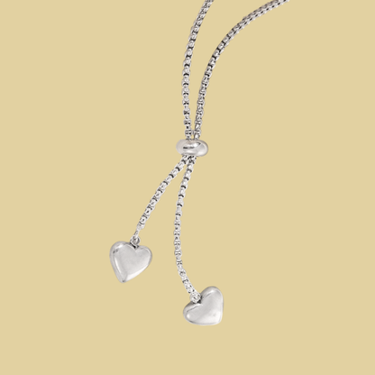 COLLAR CORBATIN CORAZONES COLGANDO